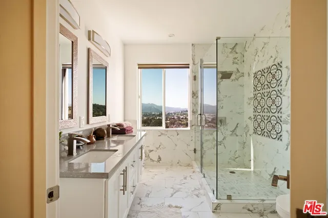 a bathroom with a sink and a large mirror