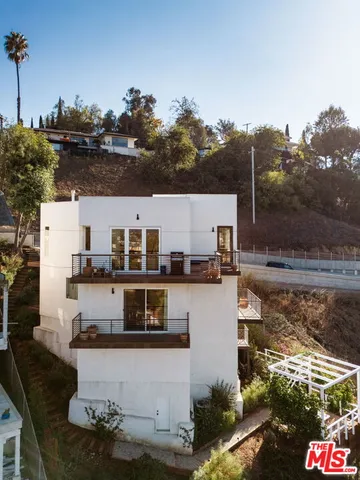 a aerial view of a house with a lake view