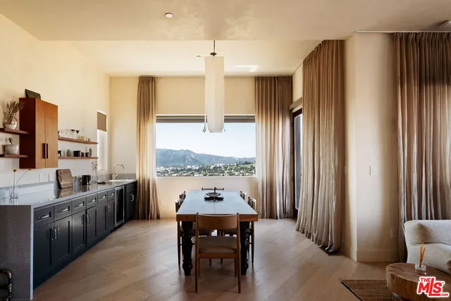 a kitchen with stainless steel appliances granite countertop a refrigerator and a stove