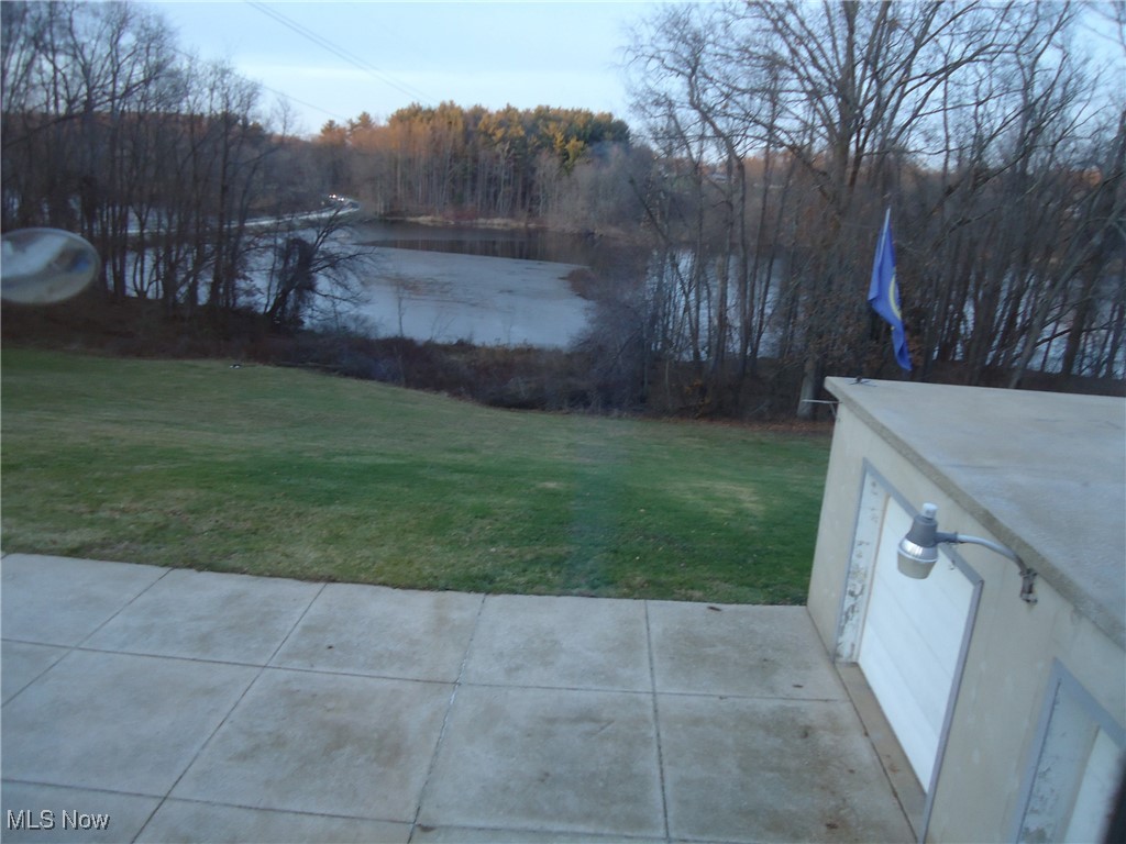 539 East Nimisila Road Uniontown, OH 44685 - Photo 29 of 41 View of yard featuring a patio area and a water view