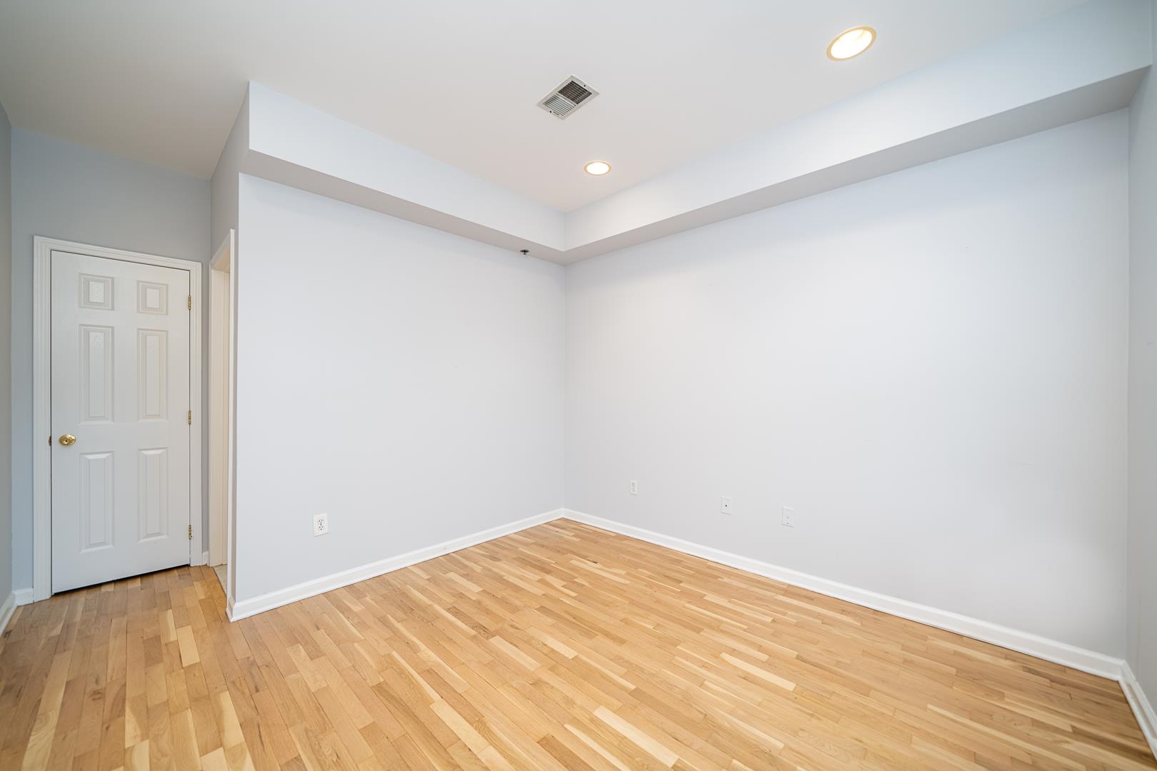 122 Monroe Street, Unit 3 Hoboken, NJ 07030 - Photo 13 of 24 a view of empty room with wooden floor