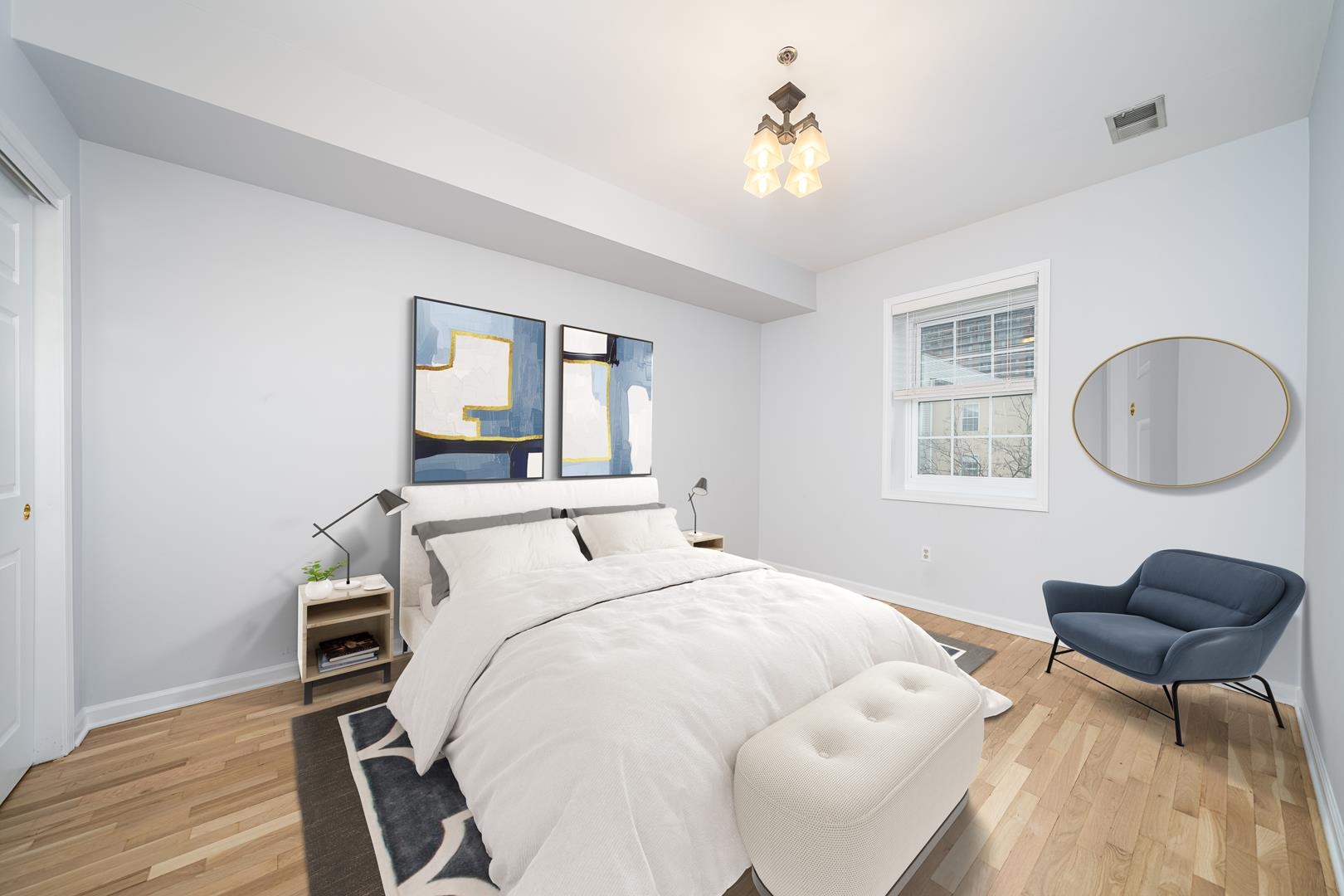 122 Monroe Street, Unit 3 Hoboken, NJ 07030 - Photo 16 of 24 a bedroom with a bed and a chair