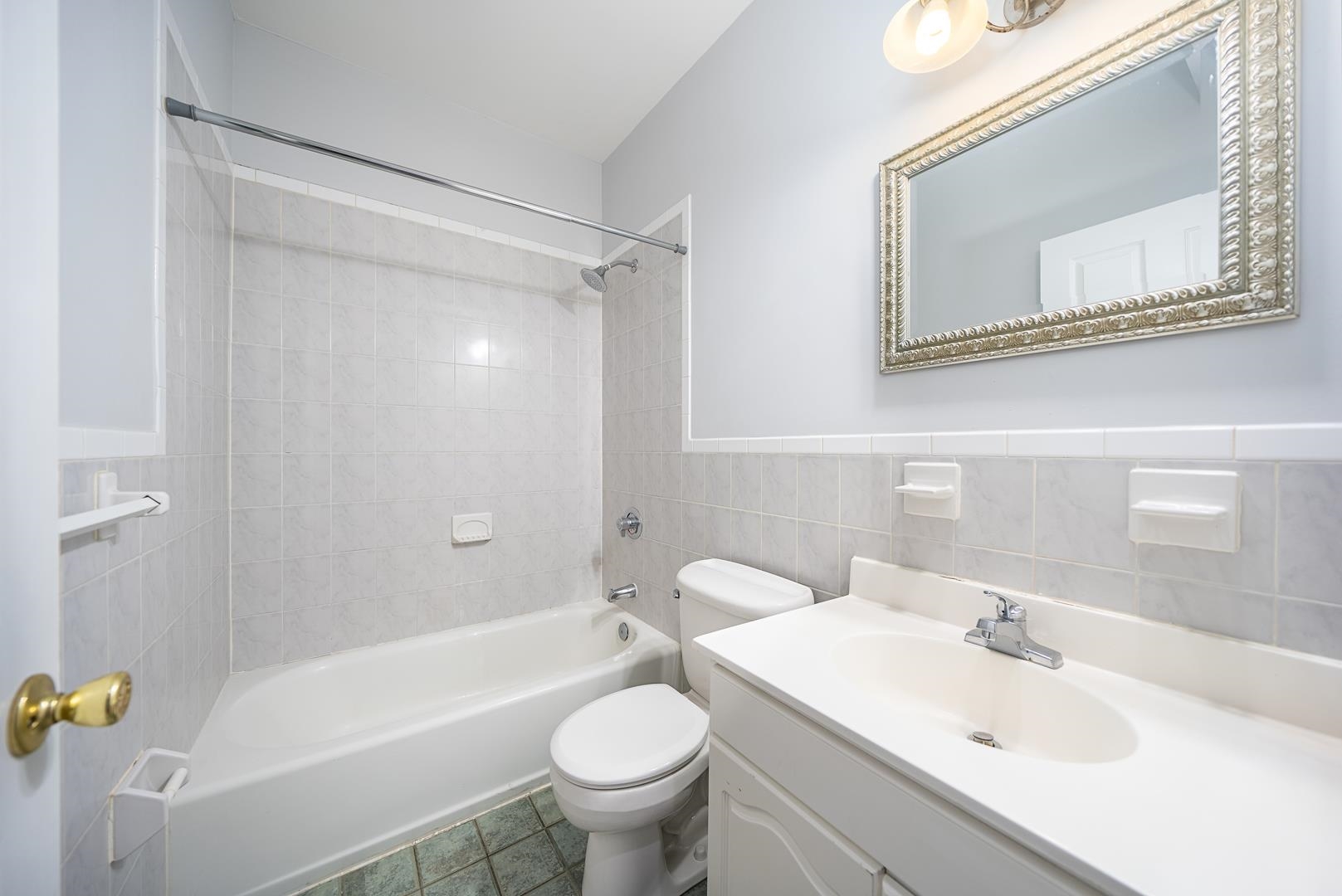 122 Monroe Street, Unit 3 Hoboken, NJ 07030 - Photo 18 of 24 a bathroom with a sink mirror toilet and bathtub
