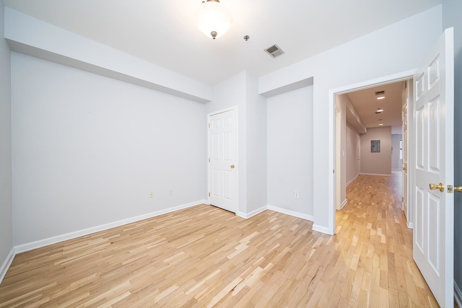 122 Monroe Street, Unit 3 Hoboken, NJ 07030 - Photo 20 of 24 a view of a room with wooden floor and bathroom