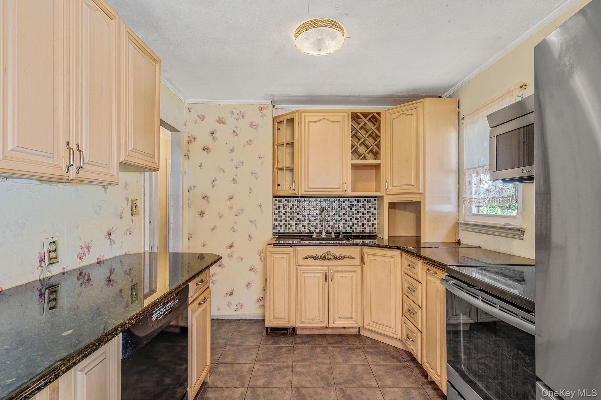 2001 North Jerusalem Road East Meadow, NY 11554 - Photo 12 of 31 a kitchen with a sink stove and cabinets