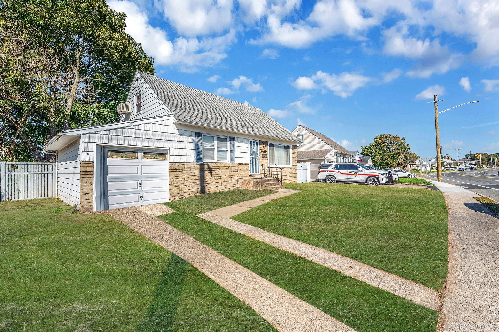 2001 North Jerusalem Road East Meadow, NY 11554 - Photo 3 of 31 a front view of a house with a yard