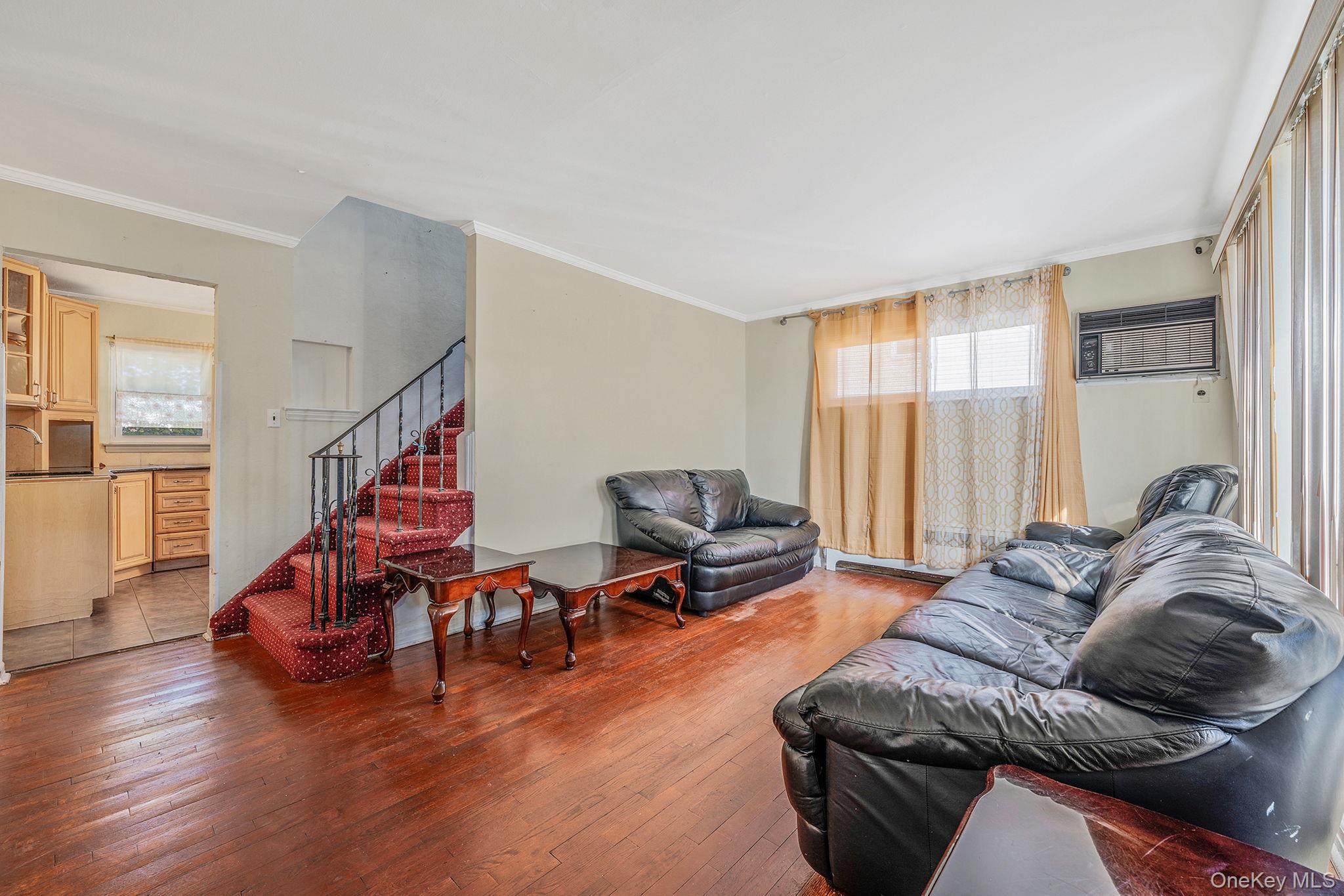 2001 North Jerusalem Road East Meadow, NY 11554 - Photo 6 of 31 a living room with furniture and hard wood flooring