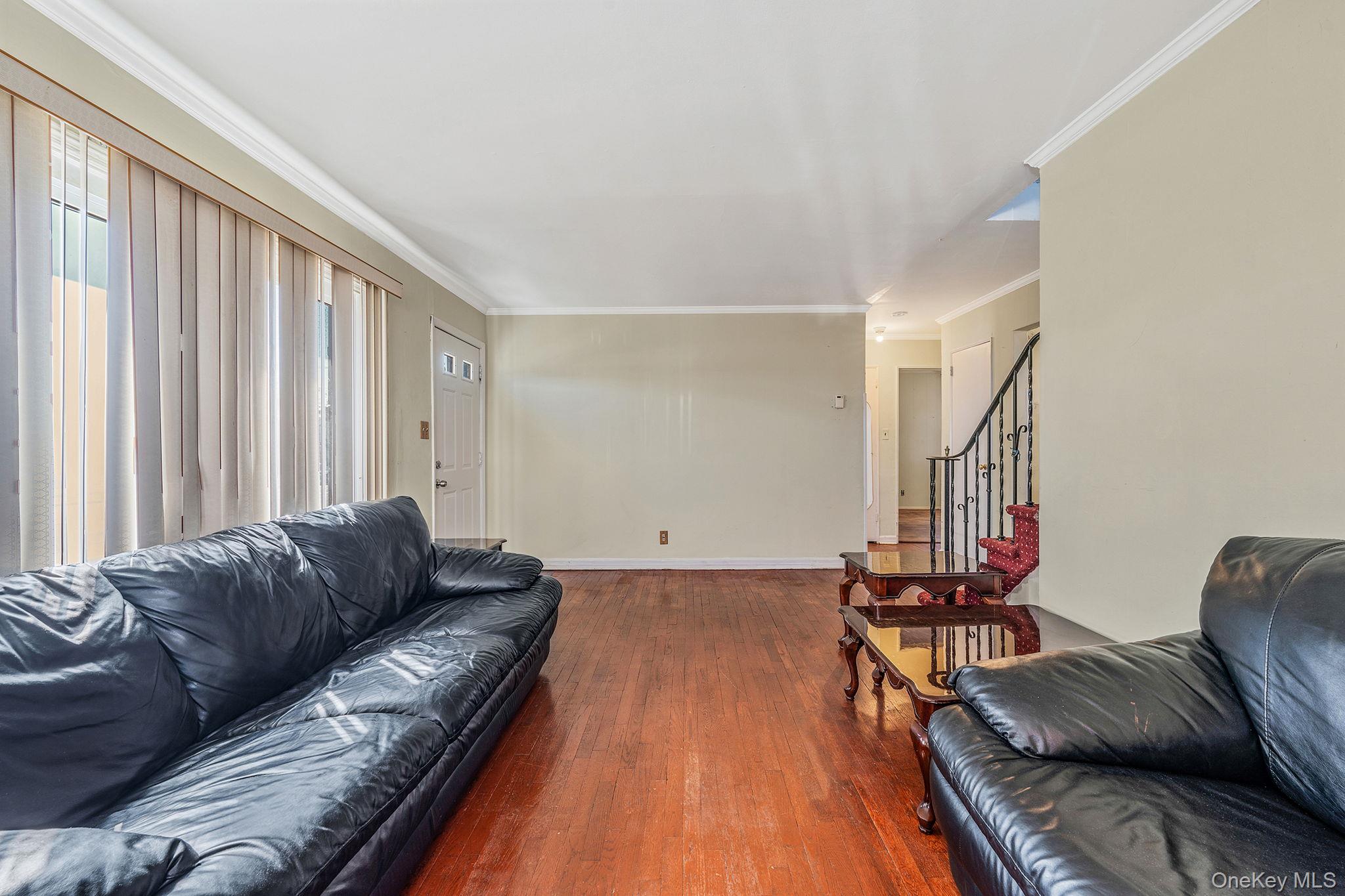 2001 North Jerusalem Road East Meadow, NY 11554 - Photo 8 of 31 a living room with furniture and a wooden floor