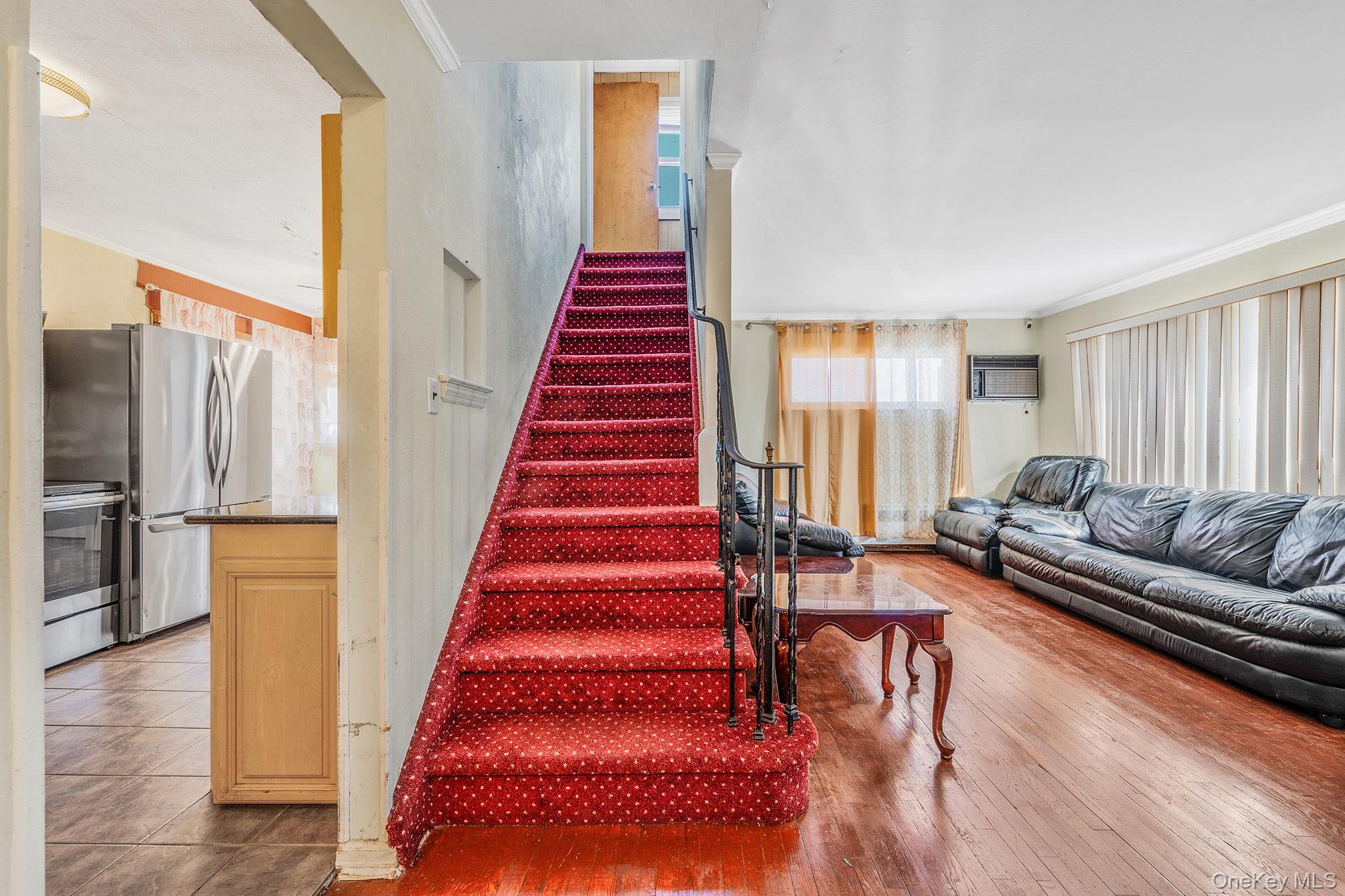 2001 North Jerusalem Road East Meadow, NY 11554 - Photo 9 of 31 a living room with furniture and a dining table with wooden floor