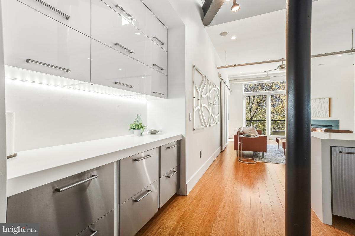 1700 Kalorama Road Northwest, Unit 407 Washington, DC 20009 - Photo 12 of 30 a view of a kitchen with wooden floor and electronic appliances