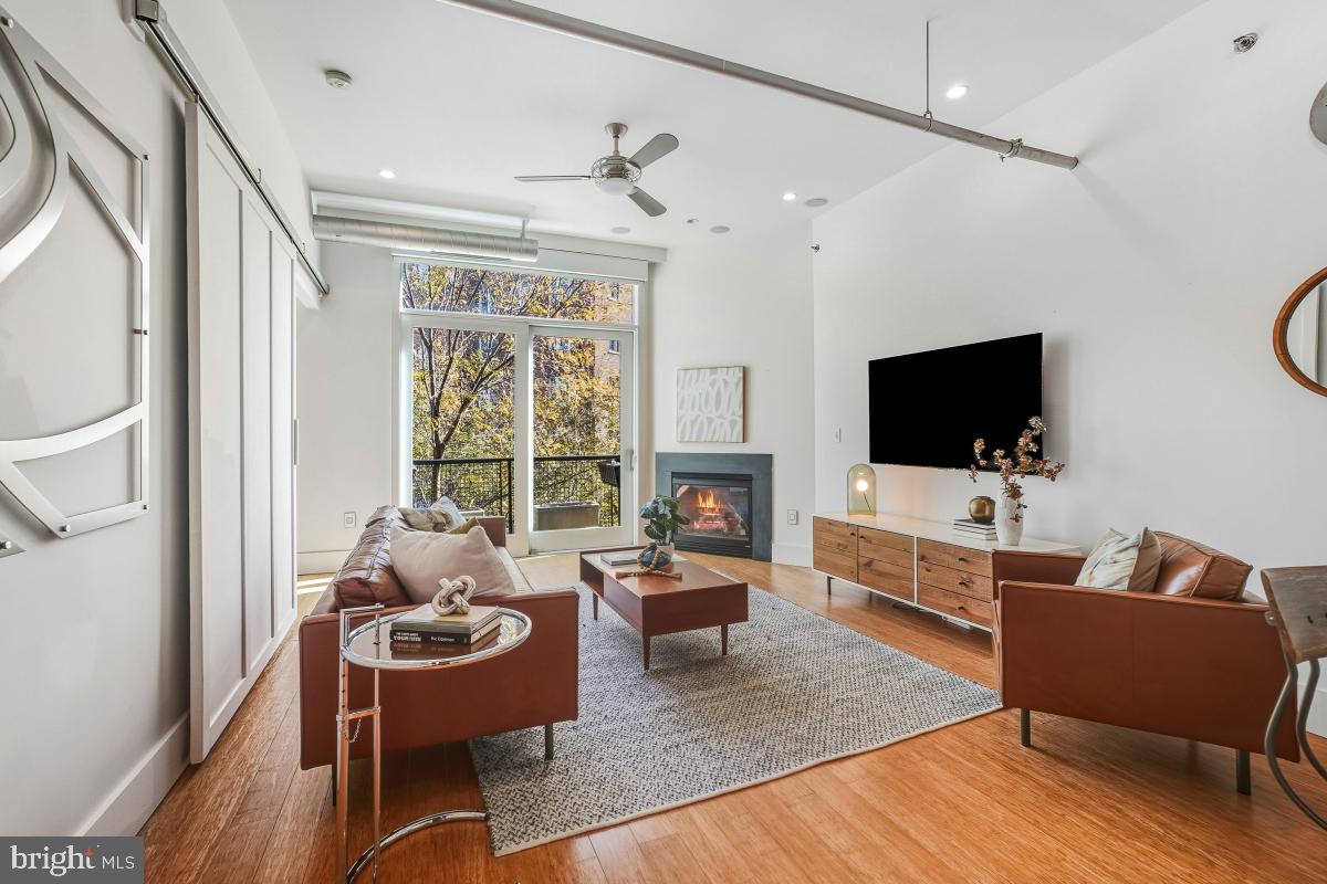 1700 Kalorama Road Northwest, Unit 407 Washington, DC 20009 - Photo 13 of 30 a living room with furniture and a flat screen tv