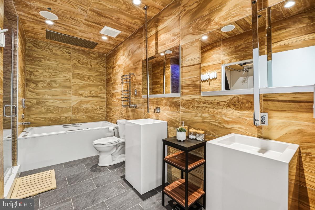 1700 Kalorama Road Northwest, Unit 407 Washington, DC 20009 - Photo 19 of 30 a bathroom with a sink a toilet and bathtub