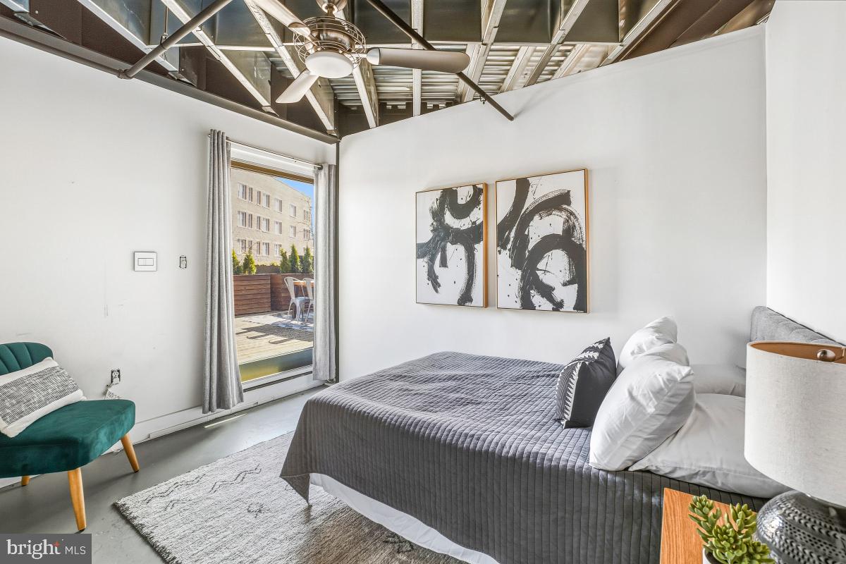 1700 Kalorama Road Northwest, Unit 407 Washington, DC 20009 - Photo 24 of 30 a bedroom with a bed and a couch