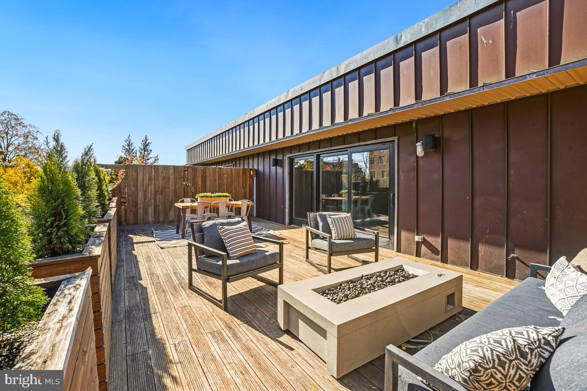 1700 Kalorama Road Northwest, Unit 407 Washington, DC 20009 - Photo 27 of 30 a view of a patio with couches table and chairs and potted plants