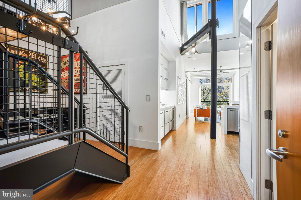 1700 Kalorama Road Northwest, Unit 407 Washington, DC 20009 - Photo 3 of 30 a view of an entryway with wooden floor and windows