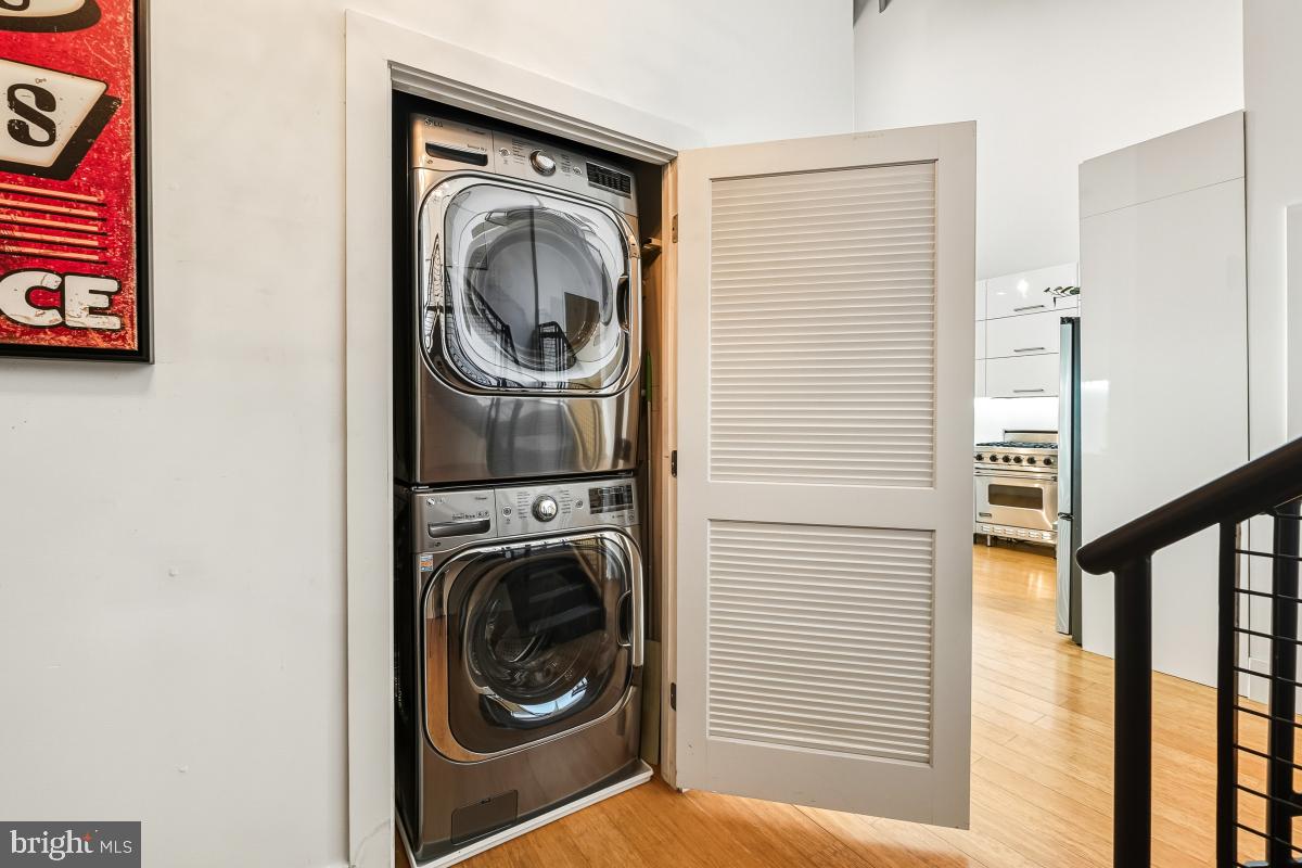 1700 Kalorama Road Northwest, Unit 407 Washington, DC 20009 - Photo 6 of 30 a view of a hallway with washer and dryer