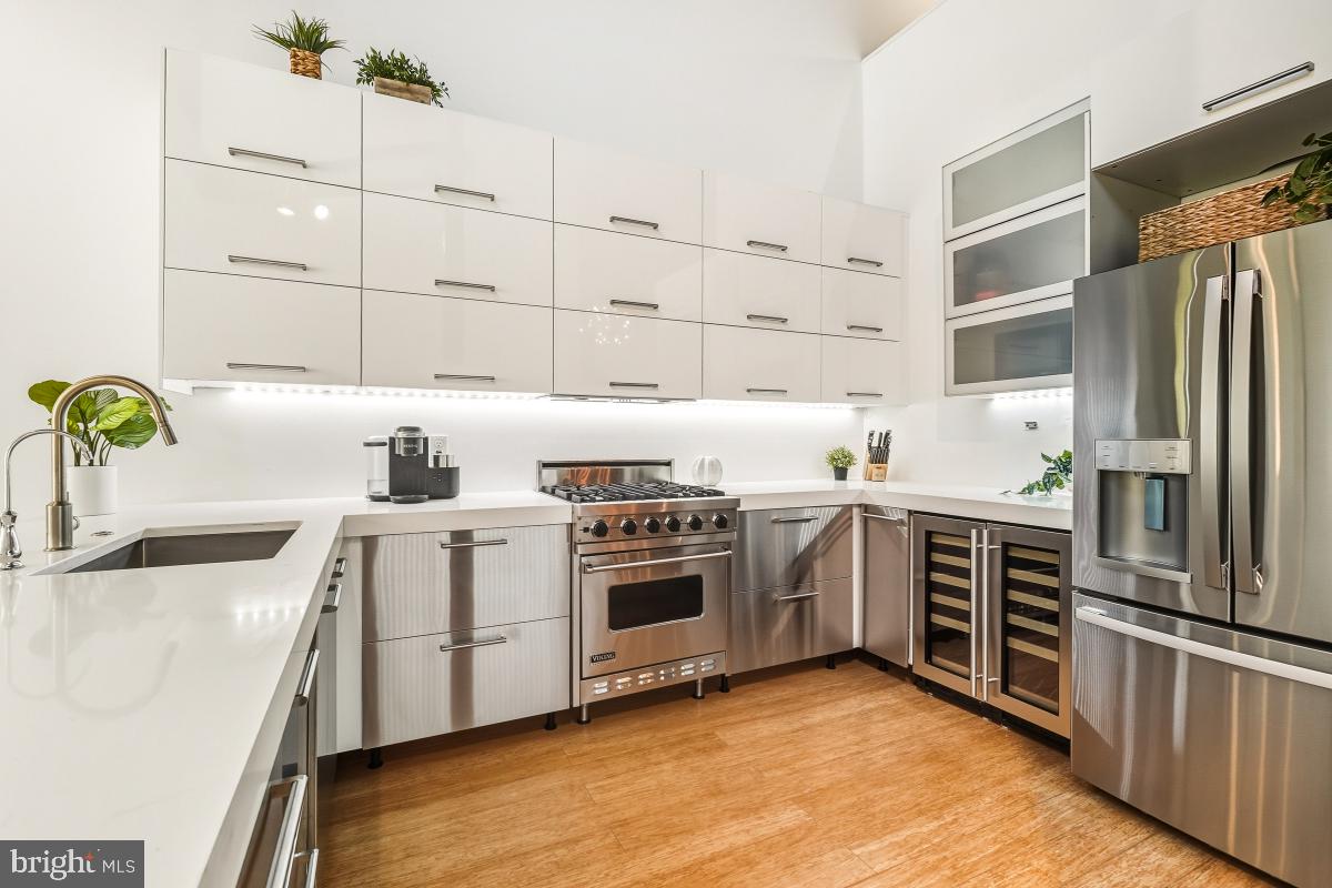 1700 Kalorama Road Northwest, Unit 407 Washington, DC 20009 - Photo 9 of 30 a kitchen with stainless steel appliances a stove sink and refrigerator