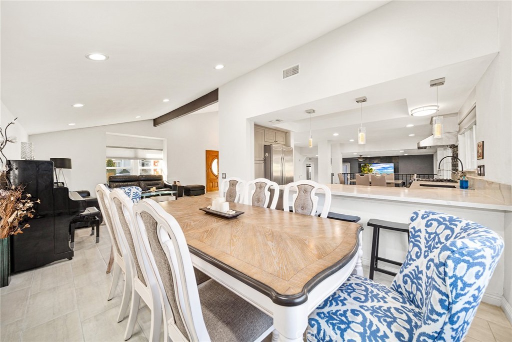 12 Rolling Hills Drive Phillips Ranch, CA 91766 - Photo 11 of 40 a living room with kitchen island furniture and a table