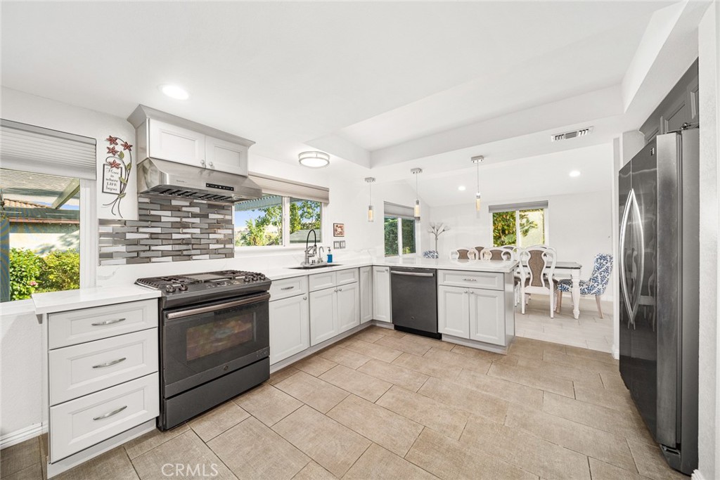 12 Rolling Hills Drive Phillips Ranch, CA 91766 - Photo 13 of 40 a kitchen with granite countertop cabinets and stainless steel appliances