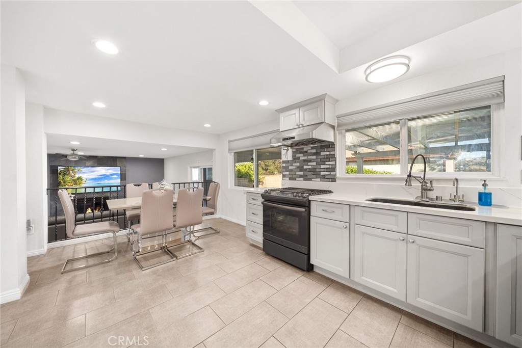 12 Rolling Hills Drive Phillips Ranch, CA 91766 - Photo 14 of 40 a room with stainless steel appliances kitchen island granite countertop a sink and cabinets