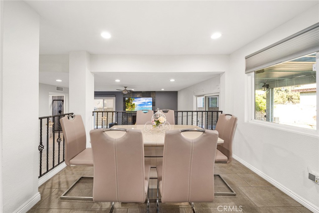12 Rolling Hills Drive Phillips Ranch, CA 91766 - Photo 16 of 40 a dining room with furniture and a wooden floor