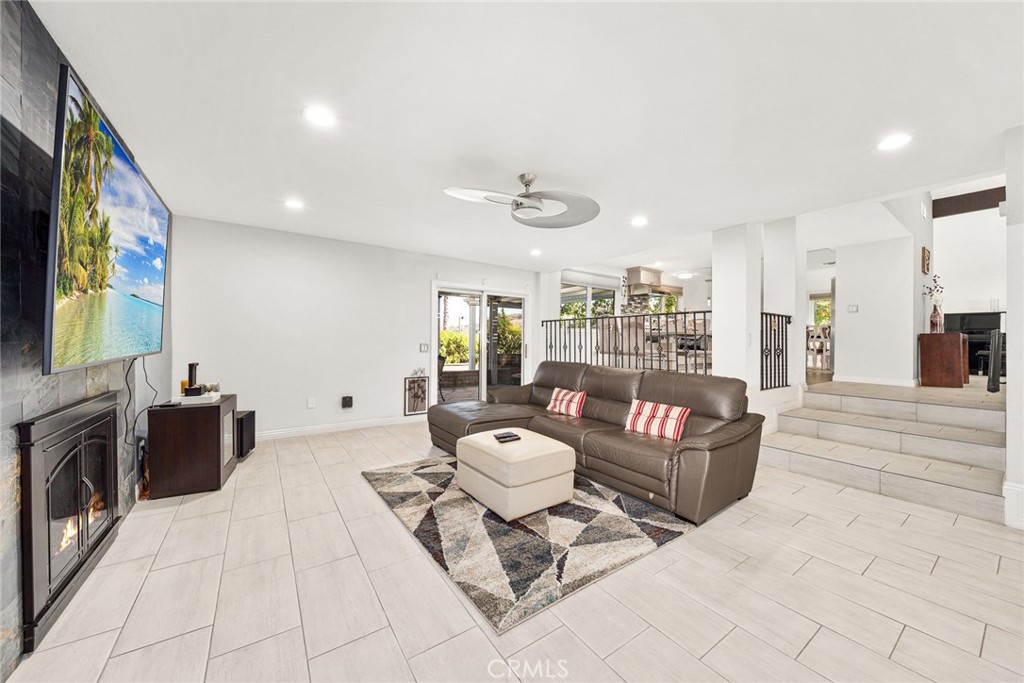 12 Rolling Hills Drive Phillips Ranch, CA 91766 - Photo 18 of 40 a living room with fireplace furniture and a flat screen tv