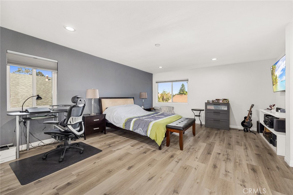 12 Rolling Hills Drive Phillips Ranch, CA 91766 - Photo 22 of 40 a bedroom with a bed a desk and chair