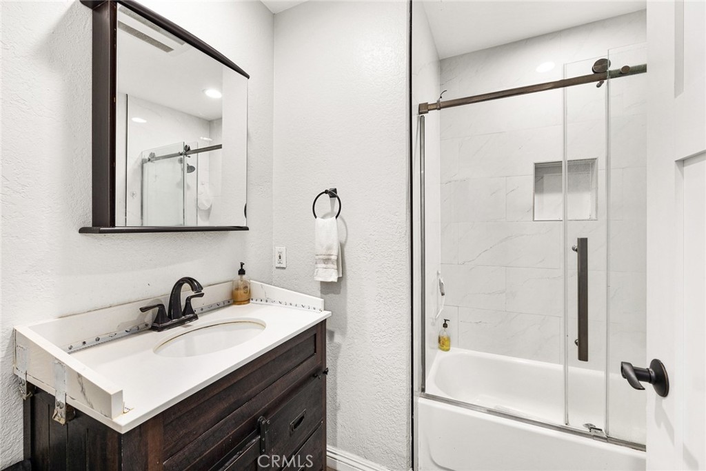 12 Rolling Hills Drive Phillips Ranch, CA 91766 - Photo 27 of 40 a bathroom with a sink and a mirror
