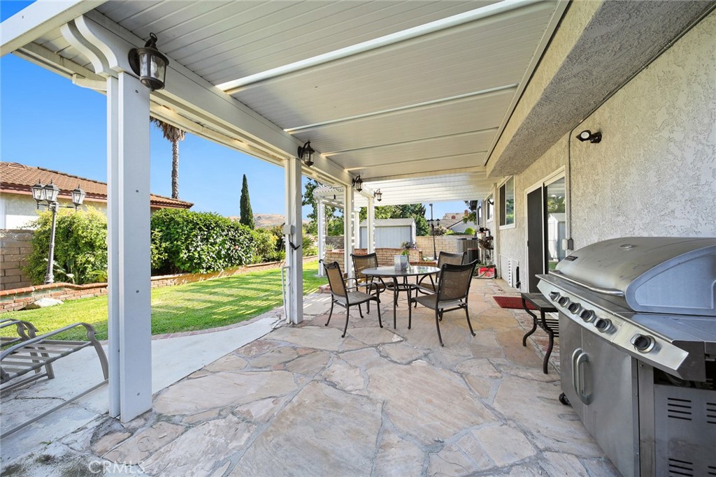 12 Rolling Hills Drive Phillips Ranch, CA 91766 - Photo 30 of 40 a view of a porch with chairs and backyard