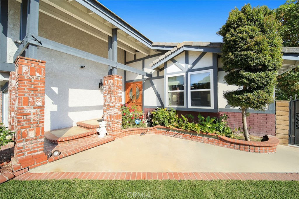 12 Rolling Hills Drive Phillips Ranch, CA 91766 - Photo 3 of 40 a front view of a house with garden