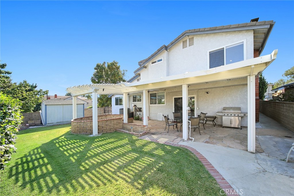 12 Rolling Hills Drive Phillips Ranch, CA 91766 - Photo 31 of 40 a front view of a house with a yard
