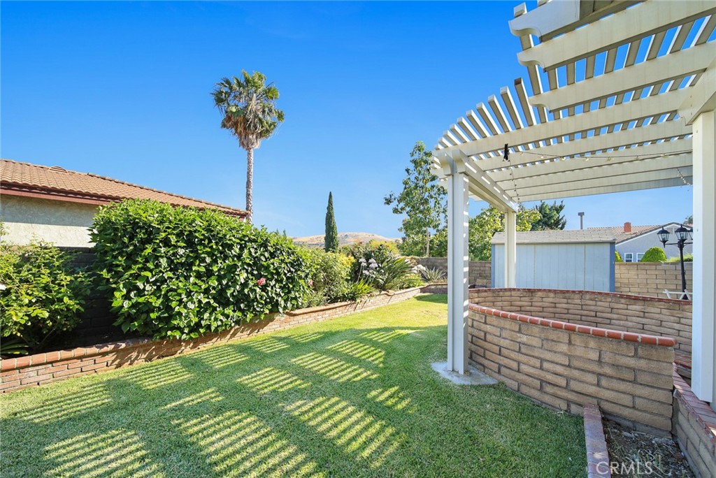 12 Rolling Hills Drive Phillips Ranch, CA 91766 - Photo 32 of 40 a view of a garden with a house