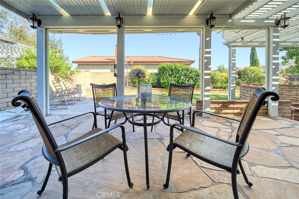 12 Rolling Hills Drive Phillips Ranch, CA 91766 - Photo 33 of 40 a view of a dining room with furniture window and outside view