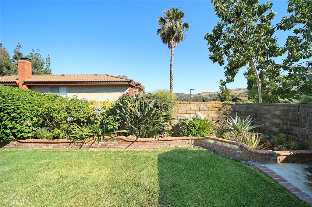 12 Rolling Hills Drive Phillips Ranch, CA 91766 - Photo 37 of 40 a view of a garden with a tree
