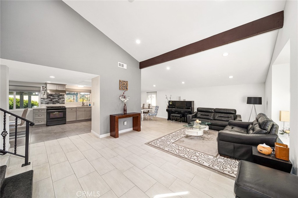 12 Rolling Hills Drive Phillips Ranch, CA 91766 - Photo 6 of 40 a living room with furniture and kitchen view