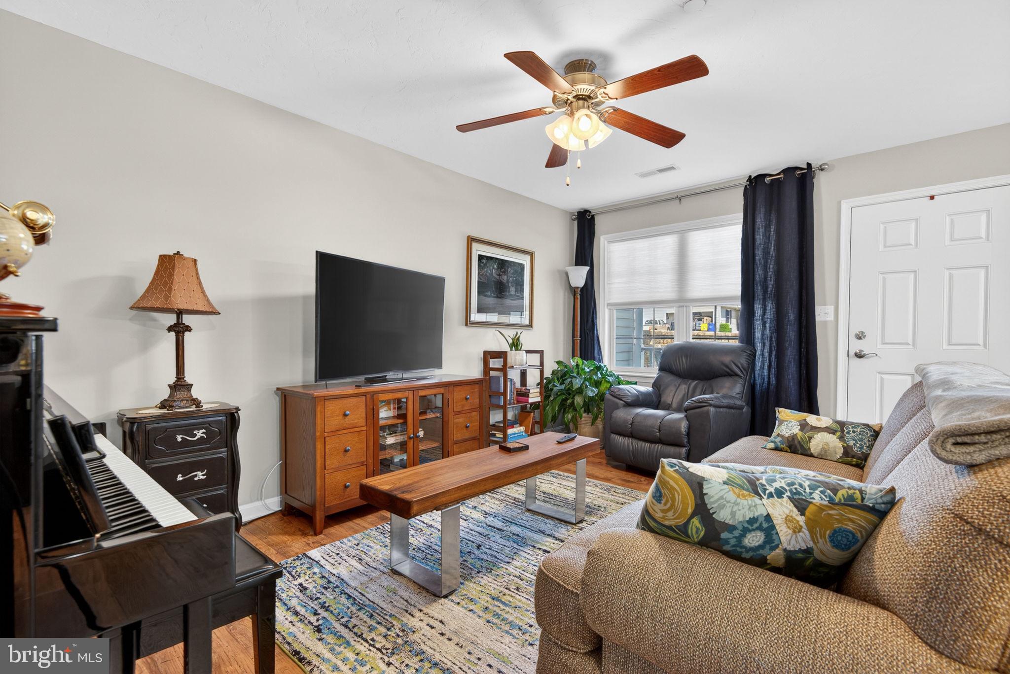 1332 Pleasant View Drive, Unit 75 Spring Grove, PA 17362 - Photo 7 of 26 a living room with furniture and a flat screen tv