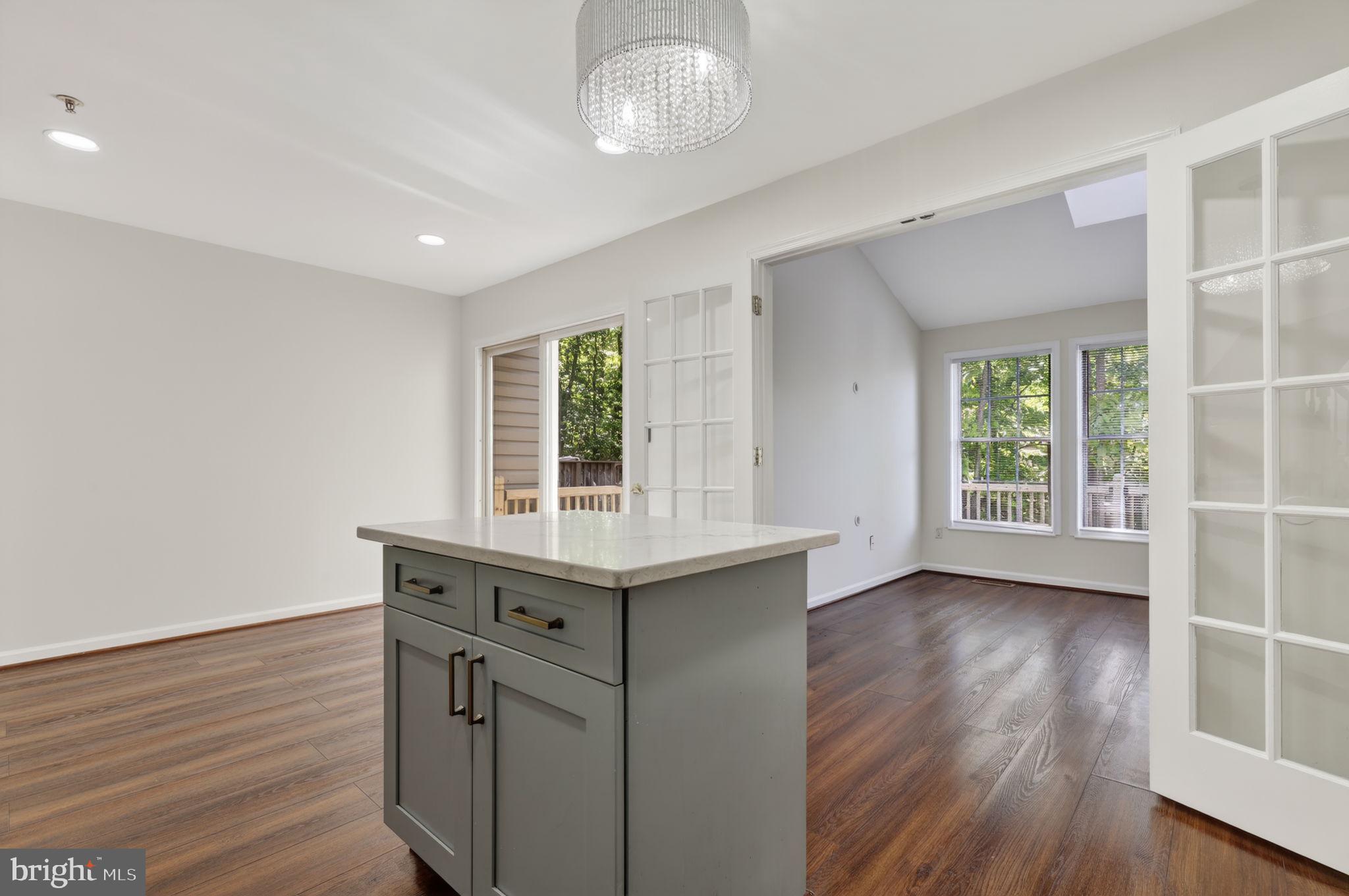 8612 Fire Rock Road Laurel, MD 20724 - Photo 17 of 57 an empty room with wooden floor and windows