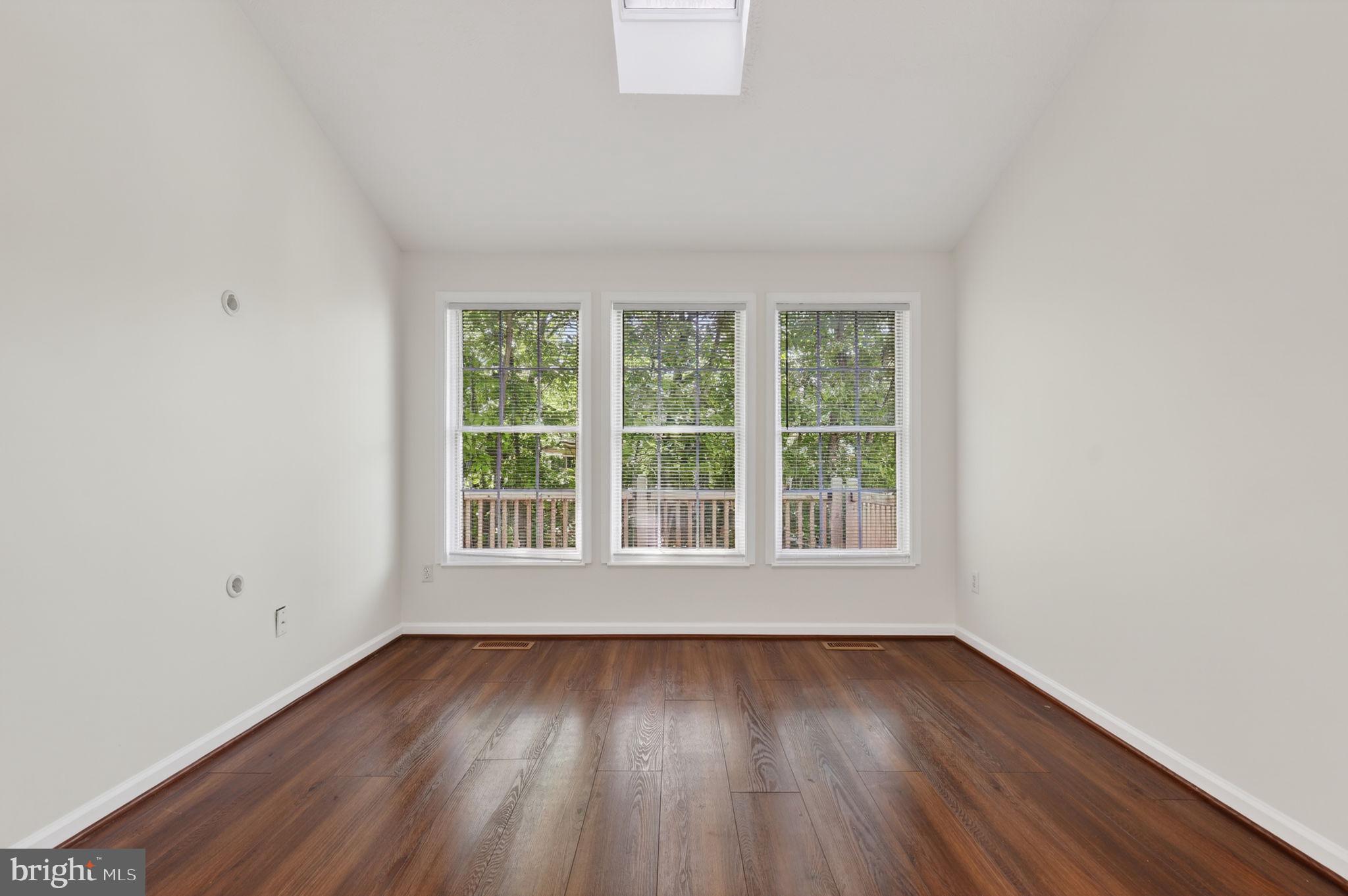 8612 Fire Rock Road Laurel, MD 20724 - Photo 19 of 57 an empty room with wooden floor and windows