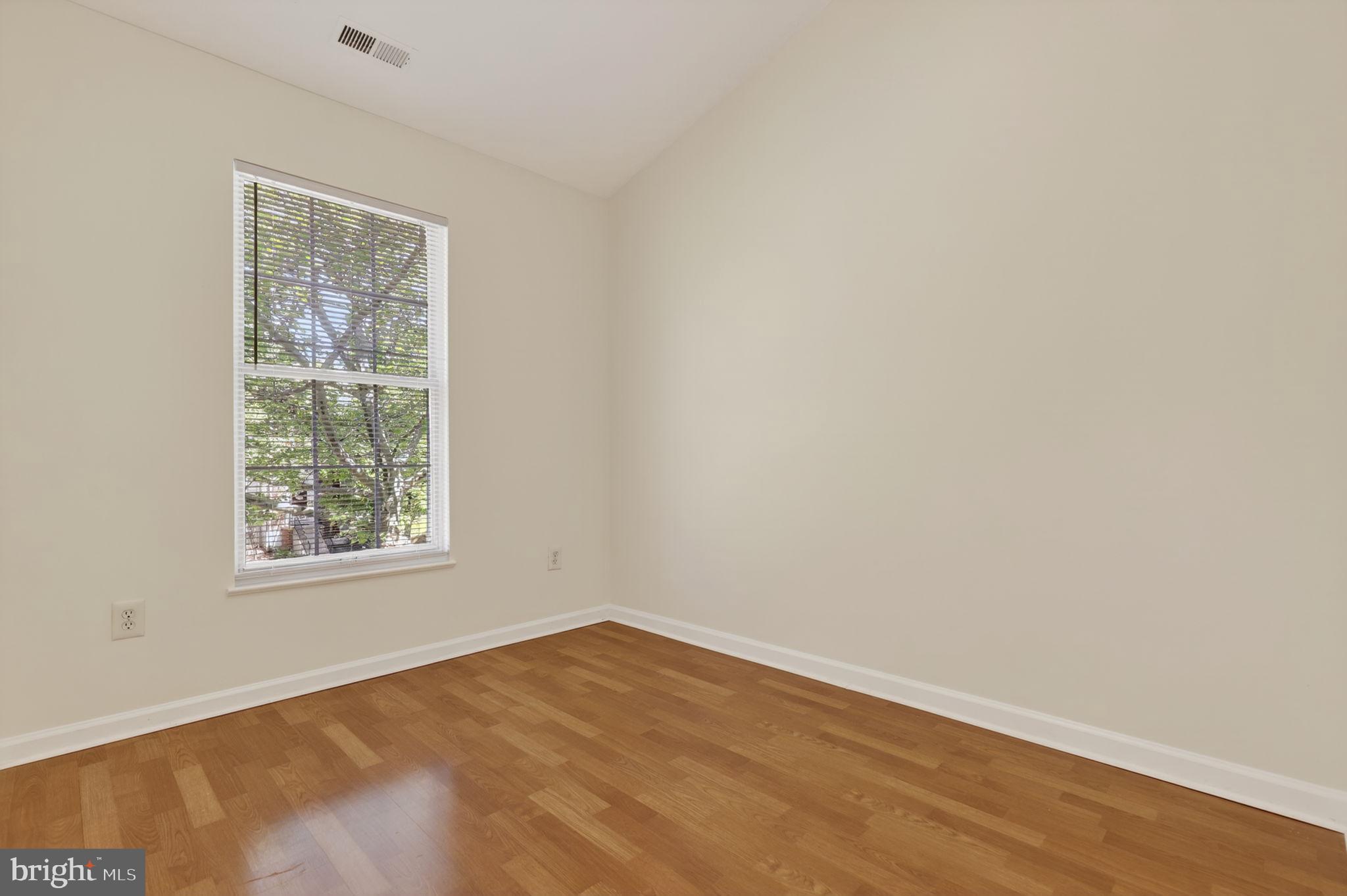 8612 Fire Rock Road Laurel, MD 20724 - Photo 34 of 57 a view of a big room with wooden floor and windows in a room