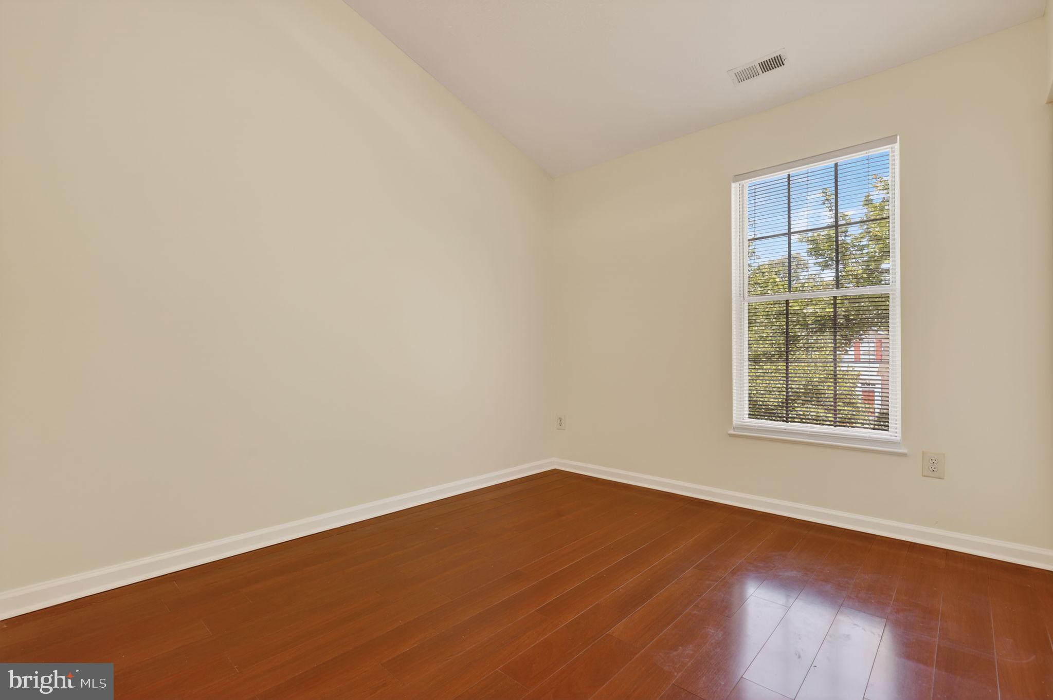 8612 Fire Rock Road Laurel, MD 20724 - Photo 36 of 57 an empty room with wooden floor and windows