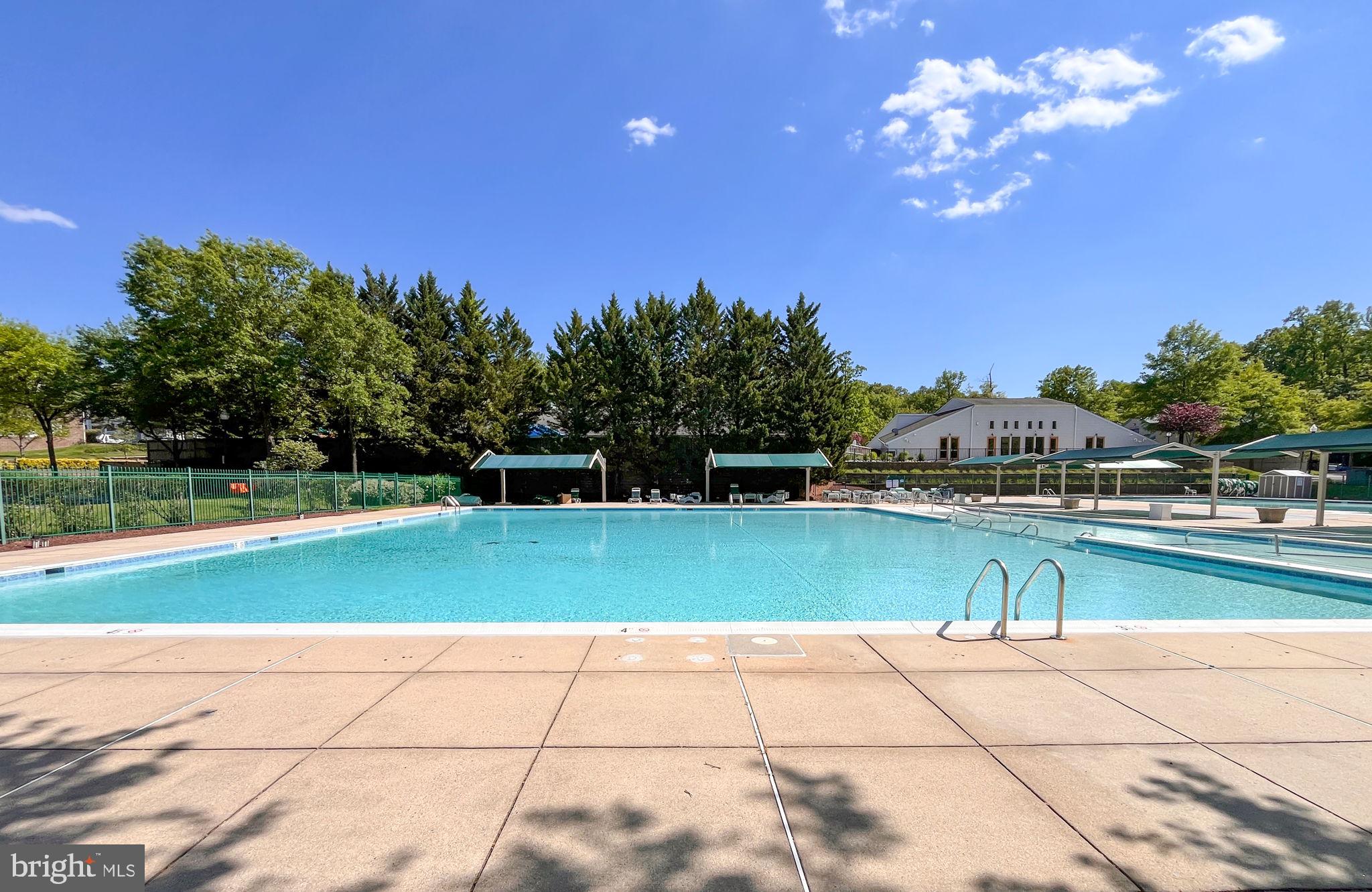 8612 Fire Rock Road Laurel, MD 20724 - Photo 49 of 57 a view of a swimming pool and trees in the background