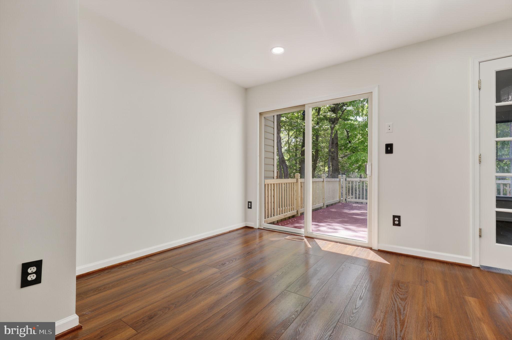 8612 Fire Rock Road Laurel, MD 20724 - Photo 10 of 57 wooden floor in an empty room with a window