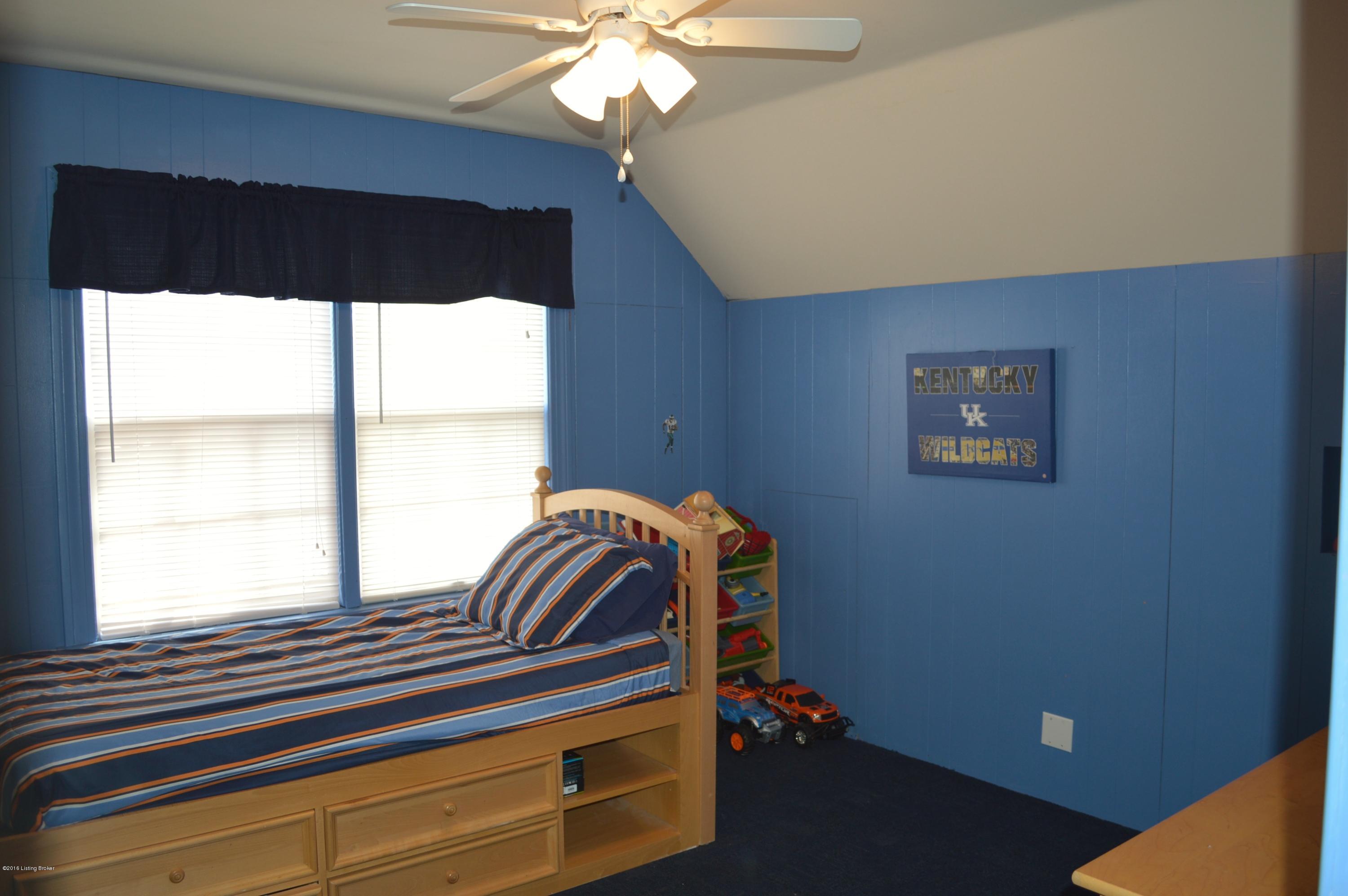 909 Perryman Road Louisville, KY 40207 - Photo 19 of 22 Upstairs bedroom offers built-in storage