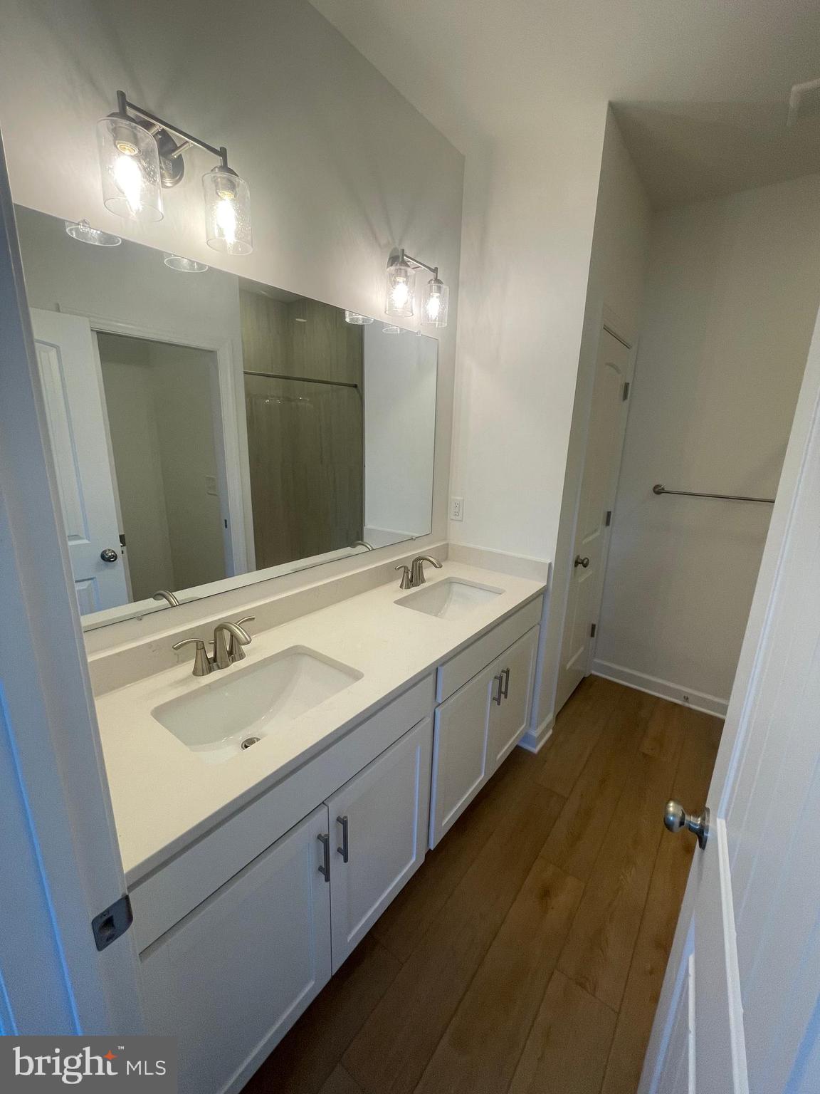 279 Ridgeview Lane, Unit 49 Hanover, PA 17331 - Photo 13 of 19 a spacious bathroom with a double vanity sink and a mirror