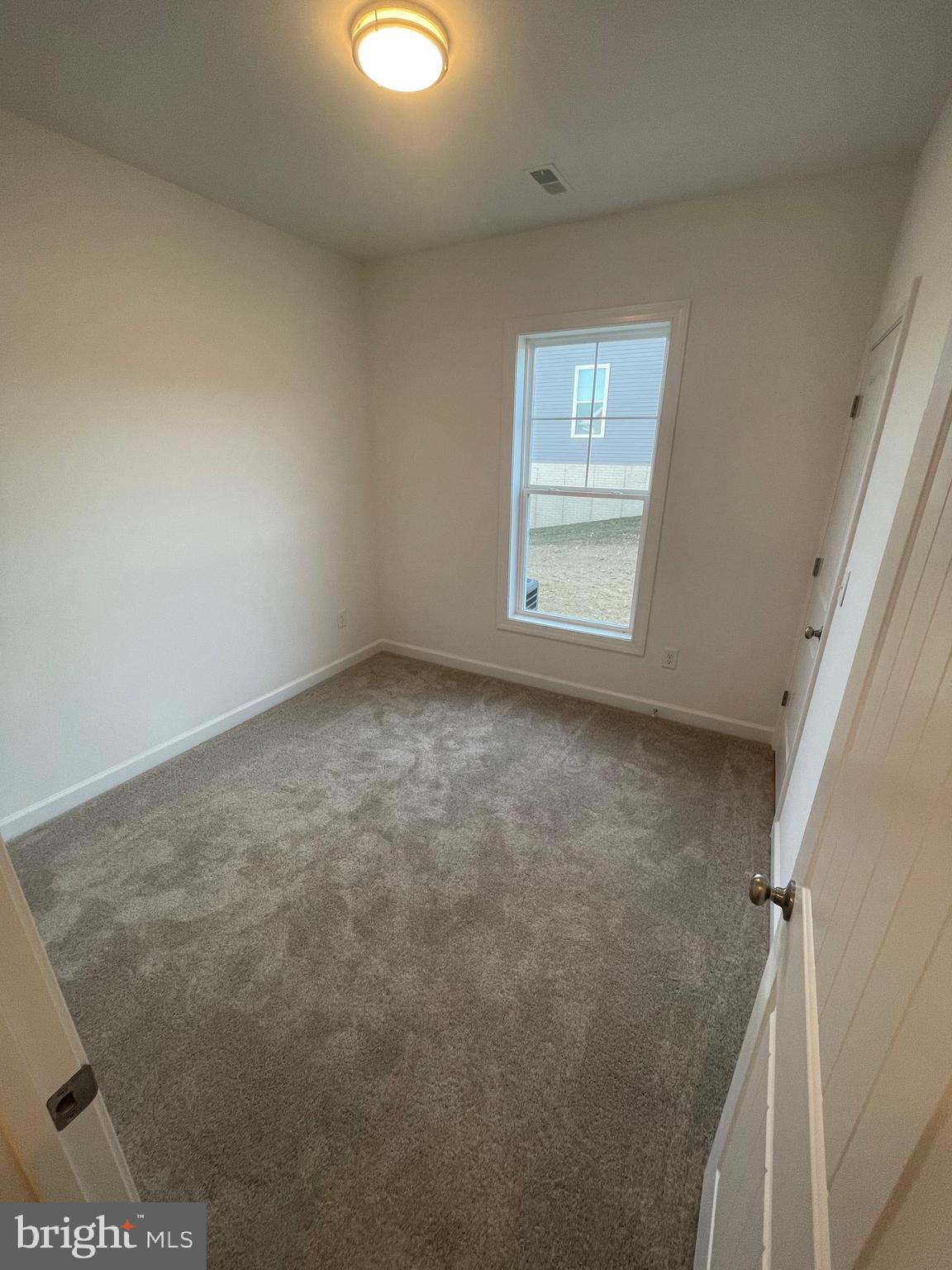 279 Ridgeview Lane, Unit 49 Hanover, PA 17331 - Photo 7 of 19 an empty room with windows