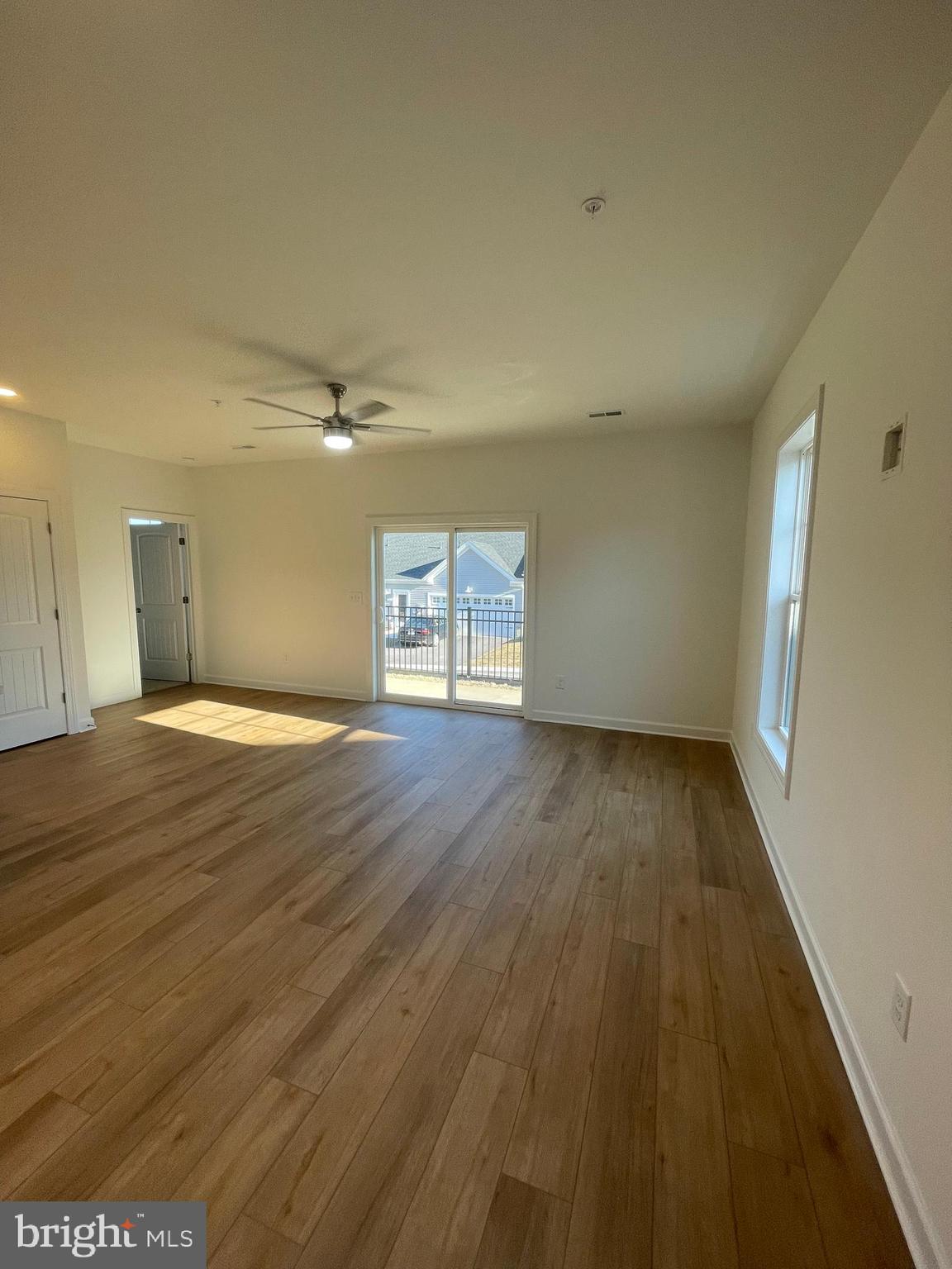 279 Ridgeview Lane, Unit 49 Hanover, PA 17331 - Photo 10 of 19 wooden floor in an empty room with a window