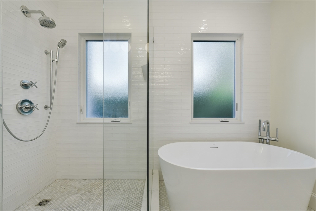 26 Bartlett Avenue Arlington, MA 02476 - Photo 11 of 27 a bathroom with a bathtub and a shower