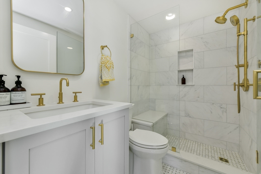 26 Bartlett Avenue Arlington, MA 02476 - Photo 19 of 27 a bathroom with a sink a toilet and shower