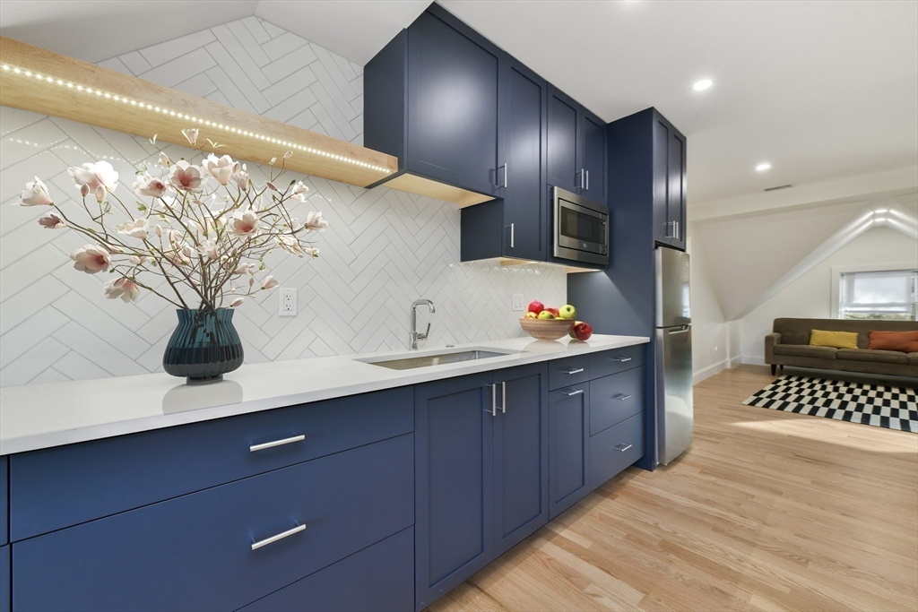 26 Bartlett Avenue Arlington, MA 02476 - Photo 22 of 27 a spacious bathroom with a sink and a mirror