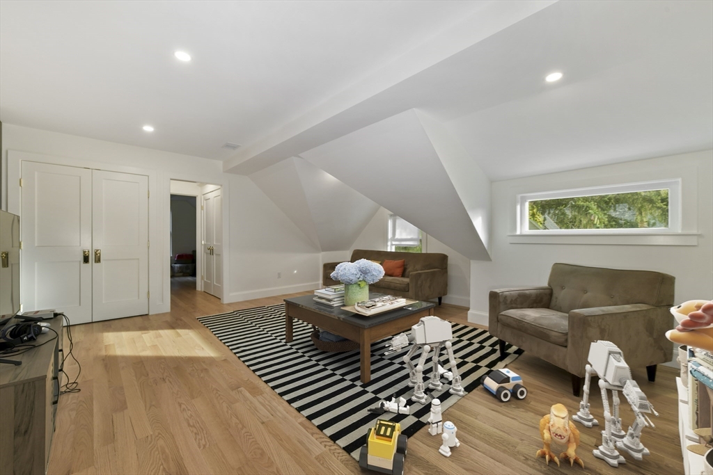 26 Bartlett Avenue Arlington, MA 02476 - Photo 23 of 27 a living room with furniture and wooden floor